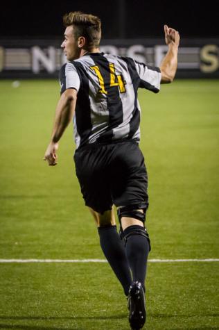 NKU player Caleb Eastham celebrates after scoring a goal in the second half of NKU's 2-0 win over UNC Asheville. NKU defeated UNC Asheville 2-0 on Oct. 22, 2014 at NKU Soccer Stadium.