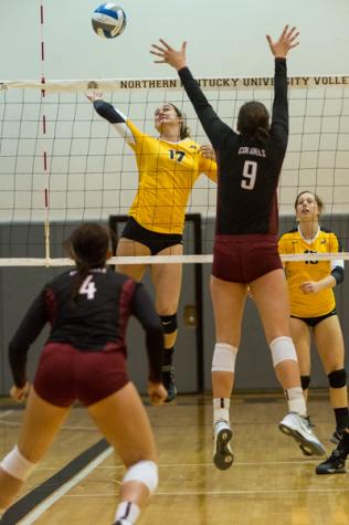 NKU's Jenna Ruble spikes the ball against an EKU player during the second set of NKU's 3-1 victory over Eastern Kentucky University. NKU defeated EKU 3-1 at Regents Hall on Northern Kentucky Campus on Oct. 28, 2014.