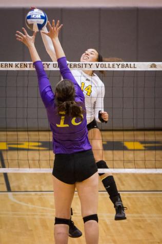 NKU's Keely Creamer kills the ball against Lipscomb in NKU's come from behind win. NKU defeated Lipscomb 3-2 at Regents Hall on Friday, Oct. 24, 2014.