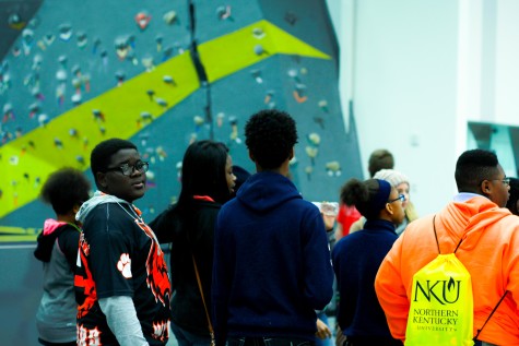 Students explore the new Campus Recreation Center, pictured here in front of the bouldering wall. 