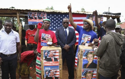 Comedians stage a mock election in the village of Kogelo, the home town of Sarah Obama, step-grandmother of President Barack Obama, in western Kenya, Tuesday, Nov. 8, 2016. Residents of the town made famous by its association with President Obama cast their "votes" for either Hillary Clinton or Donald Trump, with Clinton winning according to an organizer. (AP Photo)