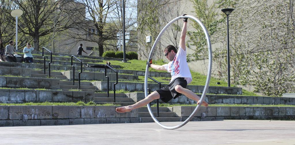 Photo by Maggie Pund
A NKU student performs on the Cyr wheel in the amphitheater for the Celebration of Student Creativity and Research. Kirk Wallace, a math and physics major, is known around campus for his creative athletic demonstrations and unusual hobbies