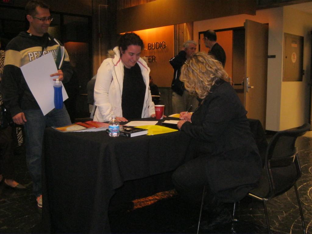 Author Lynn Hightower signs copies of her latest book at Northern Kentucky University. Hightower gave a reading of her latest novel and told the story of studying under a famous Kentucky poet to an audience on in the Otto Budig Theater on Oct. 23.