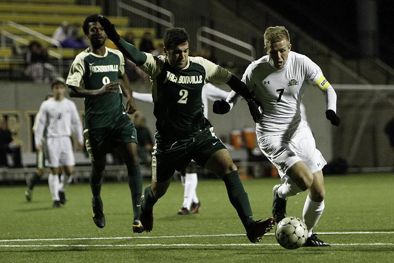 NKU Mens Soccer senior Brendan Murphy dribbles the ball towards the goal in NKUs Senior Night 2-1 win over Jacksonville Saturday night. The Norse played Jacksonville at home on Saturday, October 26, 2013, winning 2-1.