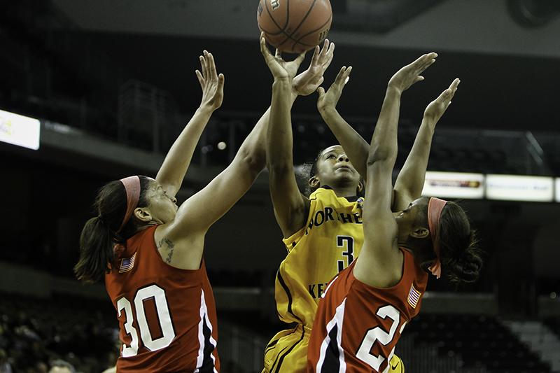 NKU guard Lauren White (#3) goes up for a layup against WKU Saturday night. Western Kentucky University defeated NKU 74-64 Saturday, November 23, 2013 at the Bank of Kentucky Center.