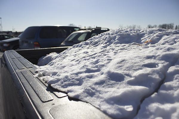 The trunk of a student’s truck on campus is filled with snow and ice after the adverse winter weather. 