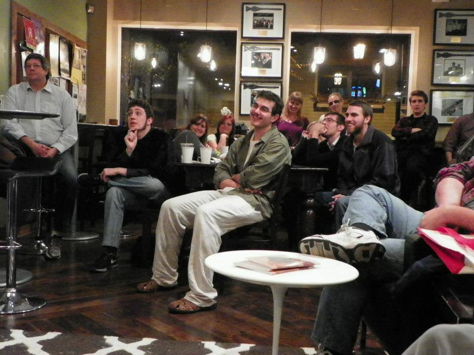 A group of students, faculty, staff and more gather at Mount Adams Bow Tie Cafe as a part of Loch Norse Magazines monthly Open Mic Nights.