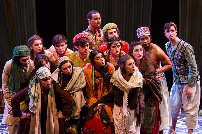 The cast of Arabian Nights look on. 