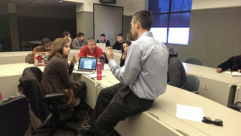 Athletes and marketing students working together for the F.A.S.T. project. 