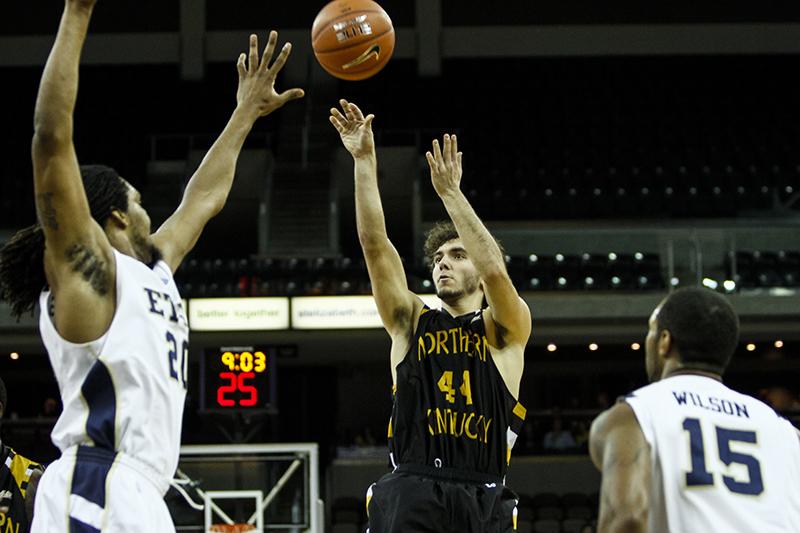 NKUs Dean Danos shoots the ball over FGCUs Hunter Harris, finishing with 10 points in NKUs loss to FGCU Thursday night. NKU lost to Florida Gulf Coast 64-50 Thursday, February 6, 2014 at The Bank of Kentucky Center.