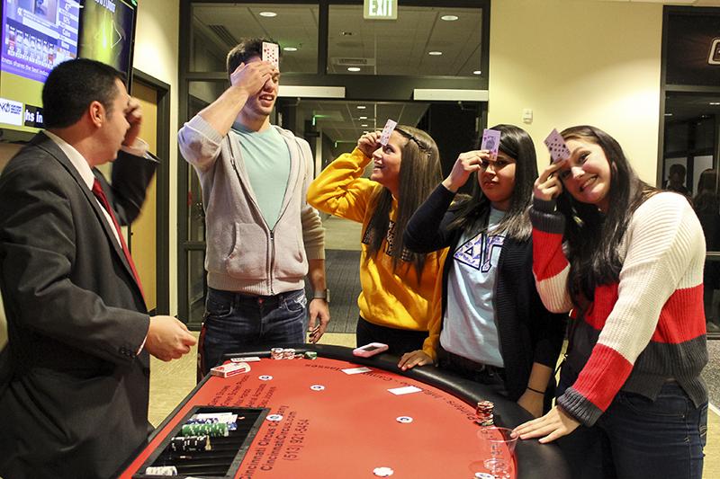 Students participate in a card game at Casino Night, part of APB's Student Union Festival. 