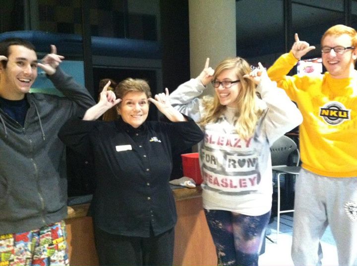From left to right Matt Hepner, Mary Pat, Emily Ries, and Taylor Dwyer throw their Norse Up in Norse Commons. 