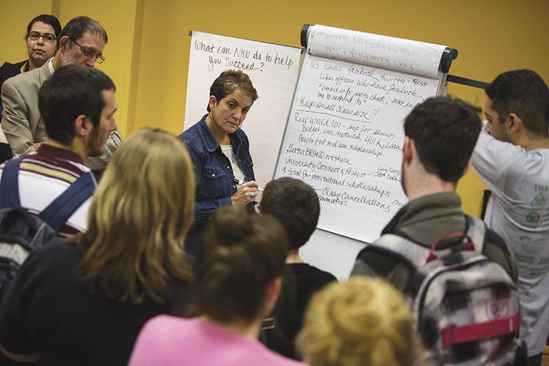 Students gathered around various strategic planning committee representatives at April 2 open forum. 