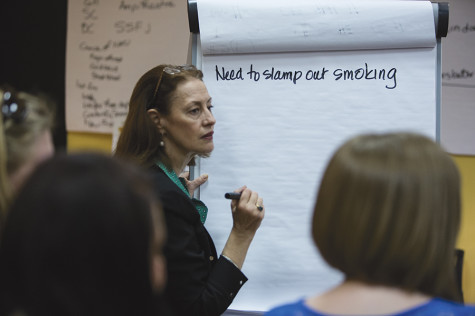 Jane Goode listens to students' ideas about the impacts of smoking on campus.