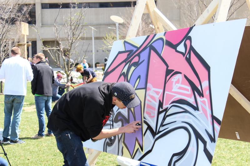One of the artists create their unique work of art on Griffin Hall lawn. 