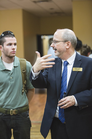 College of Informatics Dean Kevin Kirby brainstorms new ideas with students.