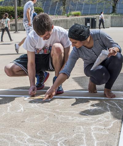 Students doing sidewalk paintings during the 2013 Celebration.
