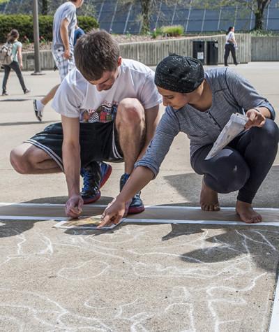 Students doing sidewalk paintings during the 2013 Celebration. 