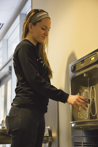 Senior BFA drawing major Denise Wellbrock refills her water bottle at a filling station in the Student Union.