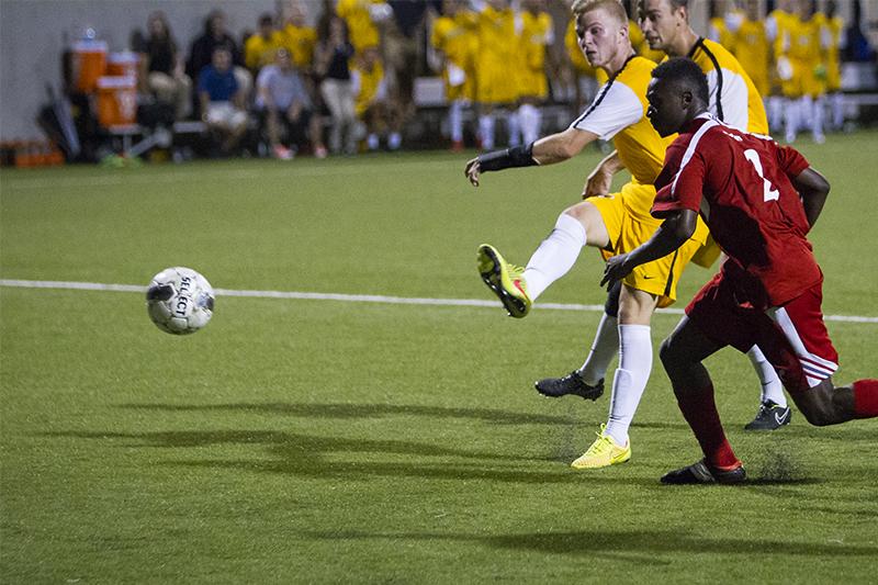 NKU mens soccer player, Ronald Moss, scores NKUs only goal in the match vs University of Cincinnati that finished in a tie. NKU hosted University of Cincinnati on Friday, August 29, 2014 at the NKU Soccer Stadium, drawing a tie at 1-1.