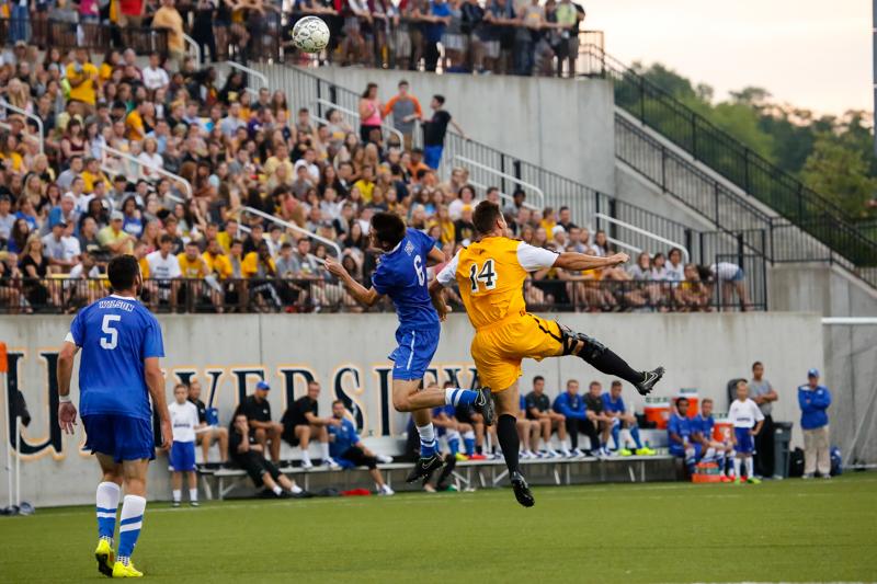 NKU Mens Soccer forward Caleb Eastham heads the ball towards the goal in the first half of NKUs home opener game vs UK. NKU tied University of Kentucky 0-0 Sunday, August 18, 2014 at NKUs Soccer Complex.