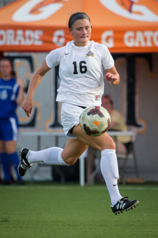 NKU women's soccer player, Kelsey Laumann dribbles down the field during NKU's 4-0 win against Eastern Illinois University. NKU defeated Eastern Illinois University 4-0 after the game was called due to lightning in the area.