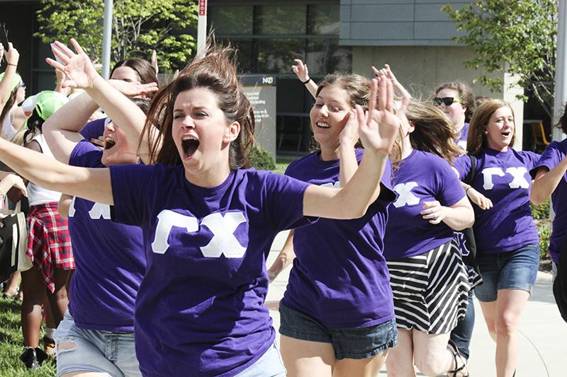 Gamma Chis Arnela Zekic and Elizabeth Ruwe take part in the bid day festivities. The event lets students meet their new families as well as promote sisterhood. 