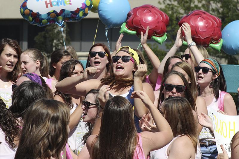 Bid day participants chant and cheer with their new sisters. 