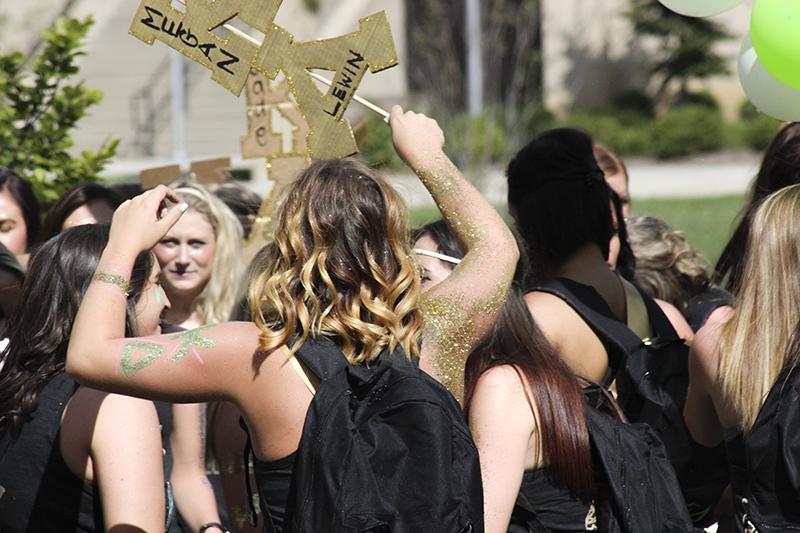 Danielle Walker, Kappa Delta member, participates in bid day. The glitter use resulted in a hefty fine. 