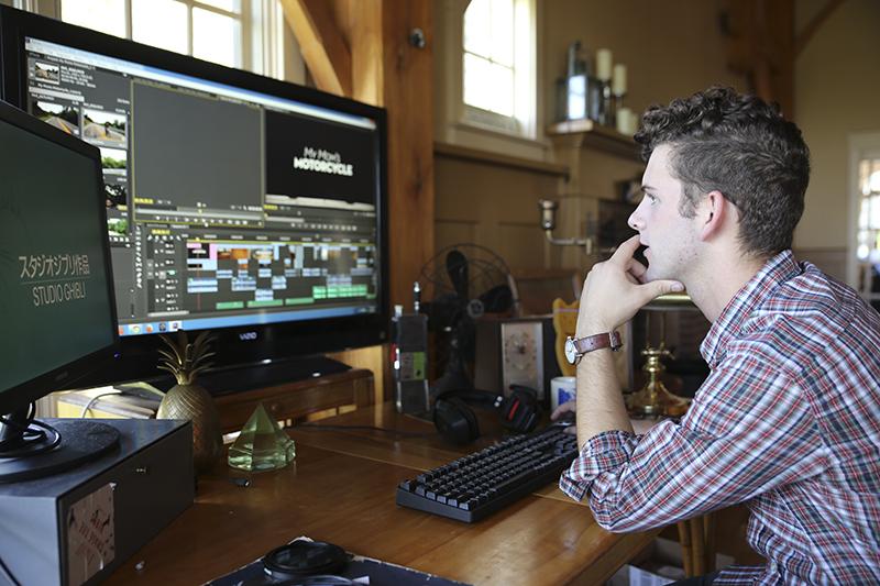 Gautraud sits at the work station where he edited together the footage that would become My Moms Motorcycle. Sitting on his desk are several of the sentimental items featured in the short film. 