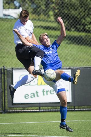 NKU forward Caleb Eastham heads the ball during NKU's tie against IPFW. NKU tied IPFW 1-1 in double overtime on Sept. 14, 2014 at NKU Soccer Stadium.