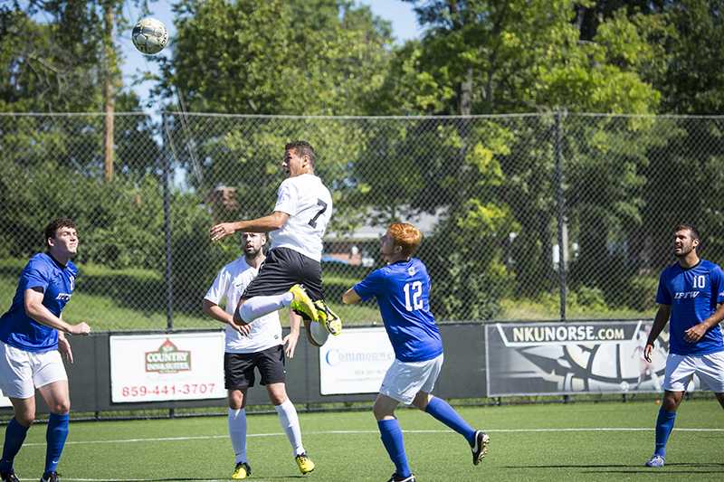 NKU midfielder Alwin Komolong heads the ball at the goal during NKUs tie against IPFW. NKU tied IPFW 1-1 in double overtime on Sept. 14, 2014 at NKU Soccer Stadium.