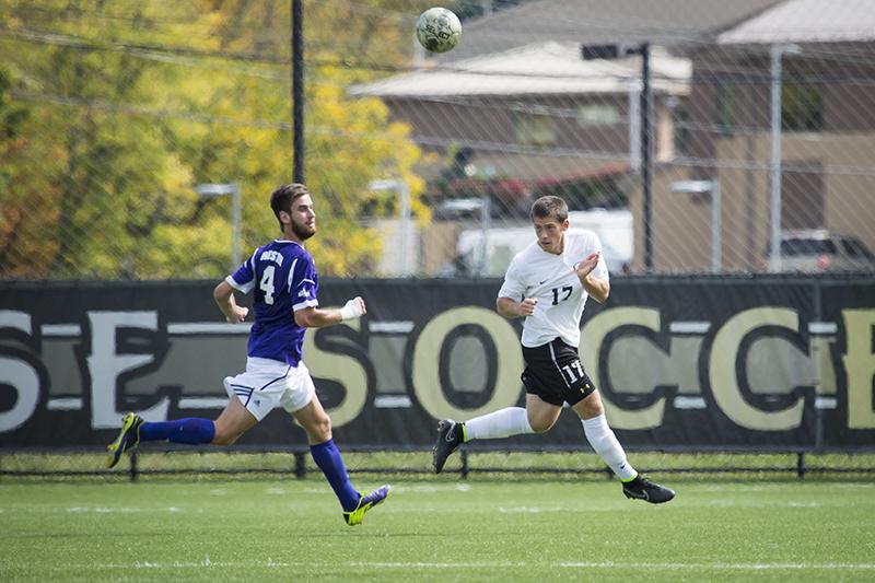 NKU's Christian Johnson heads the ball during NKU's loss to Western Illinois. NKU lost 2-0 to Western Illinois on Sunday, Sept. 28, 2014 at NKU Soccer Stadium.
