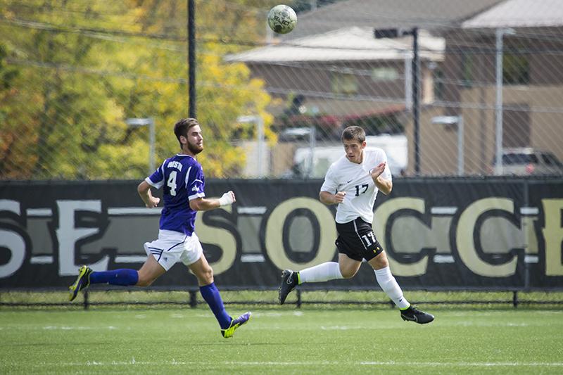 NKUs Christian Johnson heads the ball during NKUs loss to Western Illinois. NKU lost 2-0 to Western Illinois on Sunday, Sept. 28, 2014 at NKU Soccer Stadium.