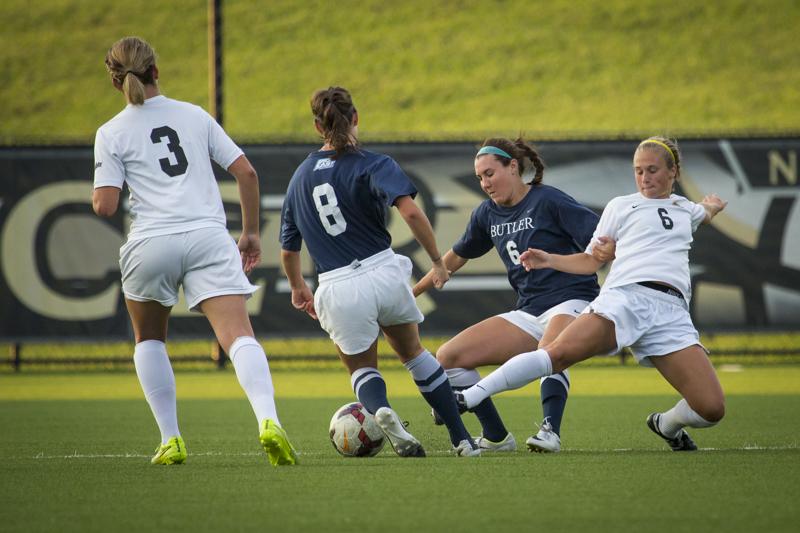 NKU midfielder Jaclyn Elmore goes for the ball in NKUs 2-1 overtime loss Wednesday night. NKU lost in overtime 2-1 against Butler University at NKU Soccer Stadium on Wednesday, Sept. 17, 2014.