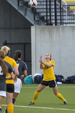 NKU midfielder Kelsey Laumann goes to head the ball during NKU's 1-1 tie against Xavier. The Norse tied Xavier 1-1 at the NKU Soccer Stadium on Sept. 9, 2014.