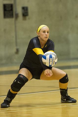 NKU libero Mel Stewart hits the ball during NKU's 3-0 loss to Eastern Michigan. NKU lost to Eastern Michigan on Saturday, Sept. 6, 2014 at Regent Hall in the inaugural Northern Kentucky Volleyball Invitational and finished 2-1 in the tournament.
