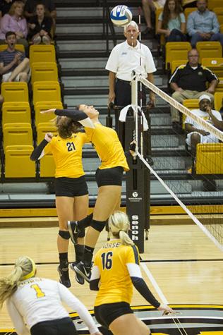 NKU's Keely Creamer (14), spikes the ball during the Norse's 3-0 win win over Samford University. Northern Kentucky University won 3-0 against Samford University in the inaugural Northern Kentucky Volleyball Invitational on Friday, Sept. 5, 2014 in Regents Hall in Highland Heights, Kentucky.