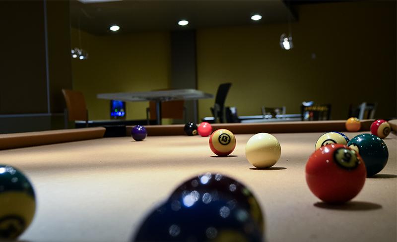 A pool table in the game room. While pool is the most popular game, students have the choice to play a variety of Wii, Playstation 3 and Xbox 360 too. 