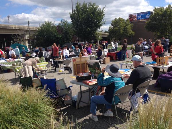 Vendors for the Yart sale present their pieces in the librarys lower parking lot.