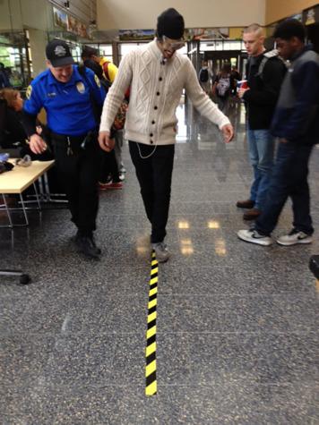 Officer Dan Fern guides a student through the Walk and Turn test.