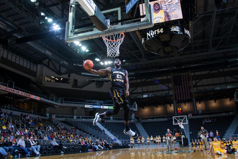 NKU mens basketball player Jalen Billups goes up for the dunk, finishing 4th in the NKU Dunk Contest at Black and Gold Madness. NKUs 2014 Black and Gold Madness was held at the Bank of Kentucky Center on October 9, 2014 celebrating the start of the 2014-15 season.