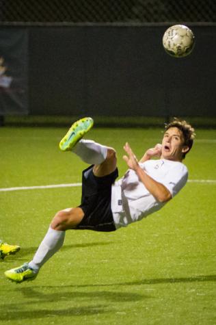 NKU's Nick McGregor shoots the ball in the second half during NKU's 3-1 loss to FGCU. The Norse lost 3-1 to Florida Gulf Coast University at NKU Soccer Stadium on Saturday, Oct. 11, 2014.