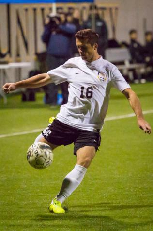 NKU's Cian McDonald cross the ball during NKU's overtime scoreless draw against Lipscomb. NKU tied Lipscomb 0-0 at NKU Soccer Stadium on Saturday Oct. 4, 2014.