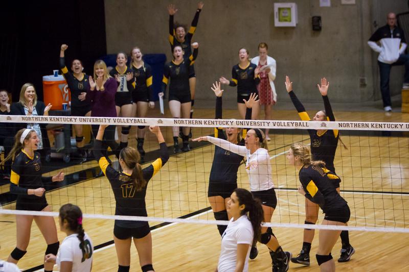 NKU volleyball celebrates their win against Jacksonville. NKU defeated Jacksonville 3-0 on Friday, Oct. 11, 2014 at Regents Hall.