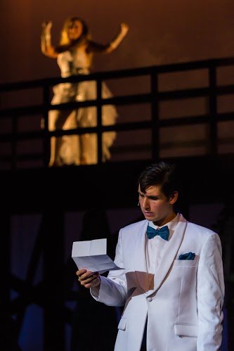 Senior Noah Berry as Robbie Hart reading break-up note from fiancee Linda, played by junior Emily Fry.