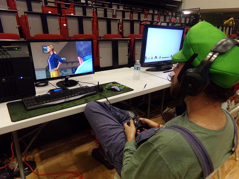 NKU student Steven Middlemas dressed as Luigi plays one of the many games at the MINjas annual charity event. 