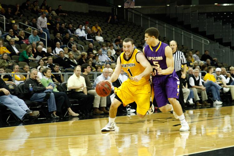 Ethan+Faulkner+drives+to+the+basket+during+the+2012-2013+season+against+Lipscomb+University.+Faulkner+is+now+an+assistant+coach+for+the+Norse.