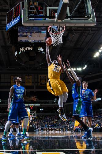 Jalen Billups dunks the ball against FGCU in the 2013-14 season. 