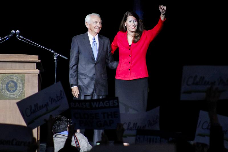 Gov. Steve Beshear welcomes Alison Lundergan Grimes to the stage. Beshear took part in Grimes rally today at The Bank of Kentucky Center.